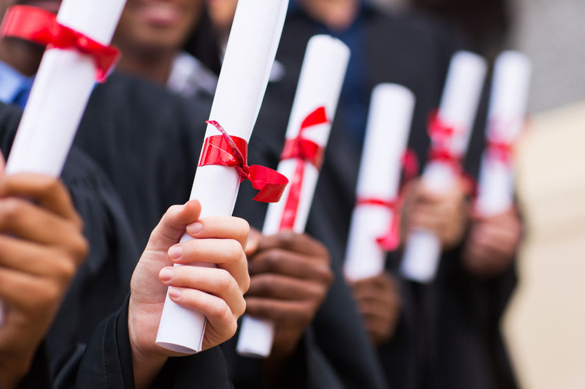 26458500 – group of multiracial graduates holding diploma