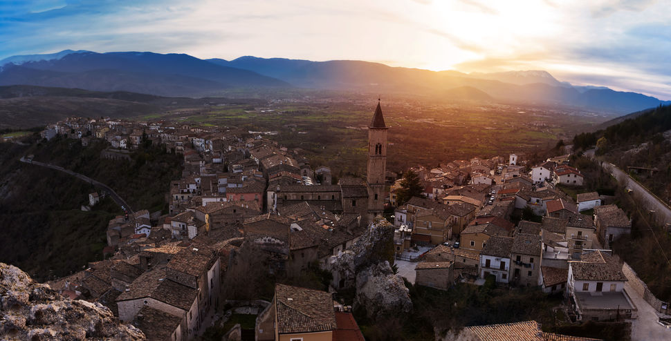 Small village on the valley at sunset (Pacentro – Italy)